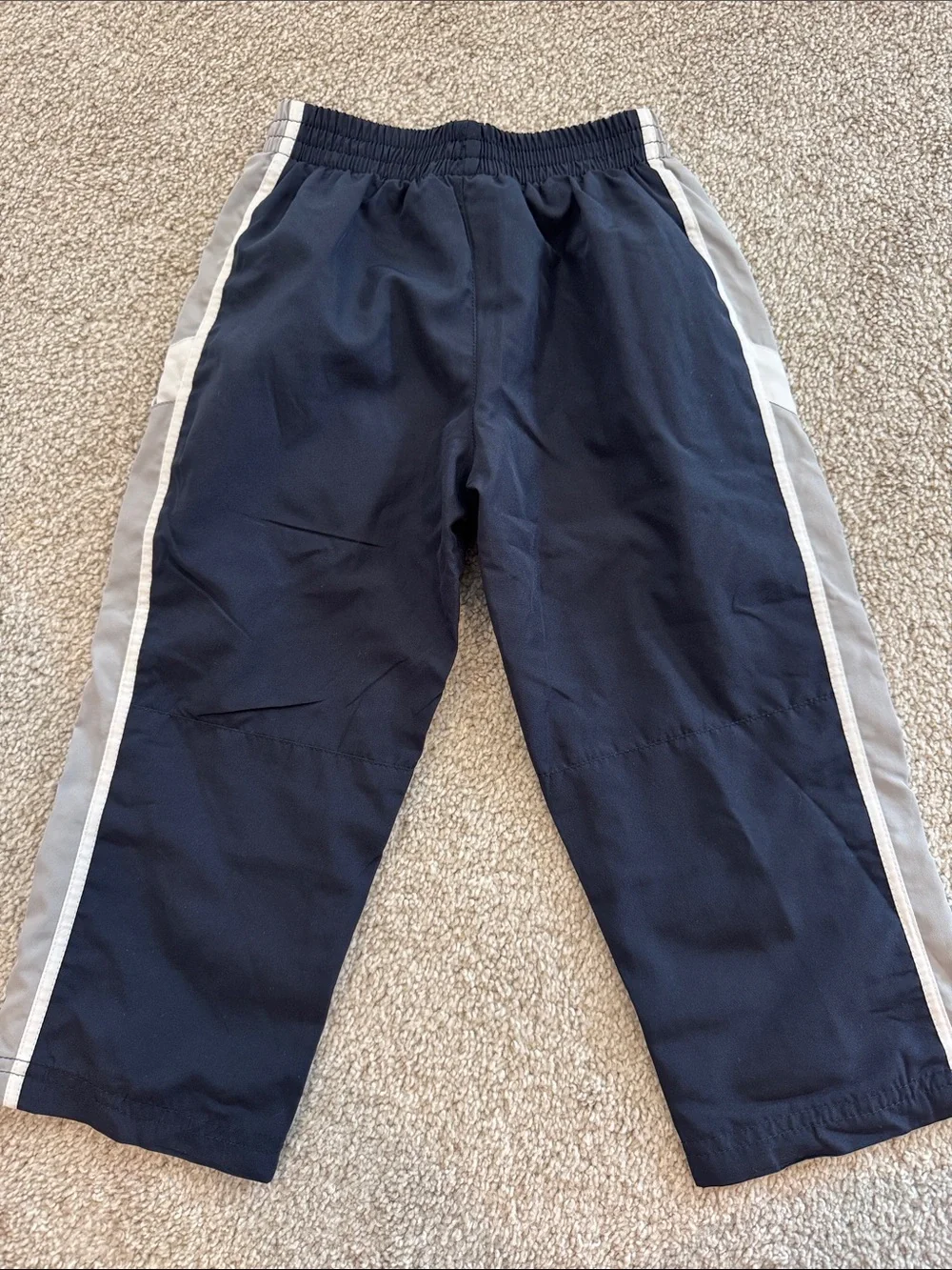 Nike Kids Navy Track Pants with Gray Side Stripes